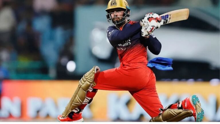 Jitesh Sharma raising bat after scoring crucial runs in IPL match