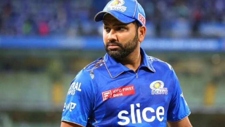 Rohit Sharma walking off field in MI jersey during IPL match, crowd in background